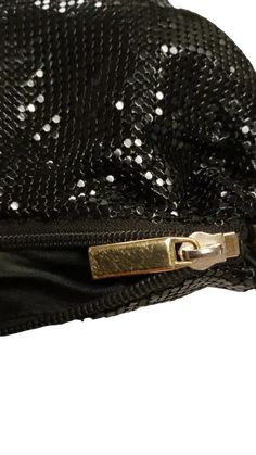 Evening Elegance Pre-Owned! Classic Black Mesh: Shimmering design for special occasions. Compact Size (9.5"L x 1"W x 6"D): Holds essentials for a night out. Detachable Chain Strap: Versatile for handheld or crossbody wear tarnished. Please Note: Pre-owned condition with minor wear scratched zipper pull, worn leather, touchy zipper. Intact Mesh & Liner: Main structure in good condition. Elegant Party Shoulder Bag With Zipper Closure, Elegant Party Bag With Zipper Closure, Black Shoulder Bag With Zipper Closure For Party, Elegant Bags With Zipper Closure For Night Out, Party Rectangular Clutch With Zipper Closure, Rectangular Party Clutch With Zipper Closure, Black Evening Bag With Zipper For Party, Glamorous Black Party Shoulder Bag, Party Black Clutch With Sequins