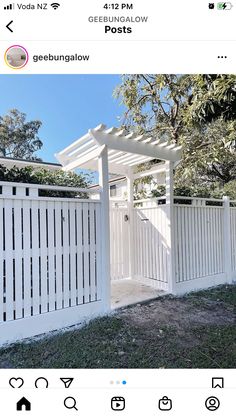 an image of a white fence and gate in the yard with text overlaying it