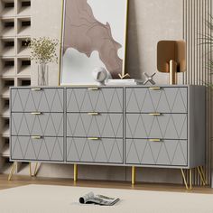 a gray and gold dresser in a living room