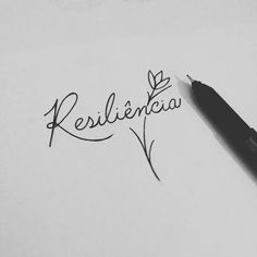 the word resilicia written in cursive writing next to a black pen