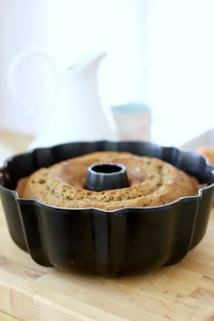 a bundt cake sitting on top of a wooden cutting board