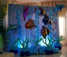 an aquarium themed birthday party with balloons and decorations