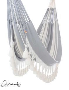 a gray and white hammock hanging from the ceiling