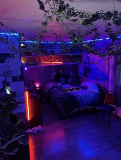 a bed room with a neatly made bed and purple lighting