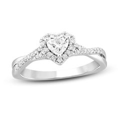 a heart shaped diamond ring with white diamonds