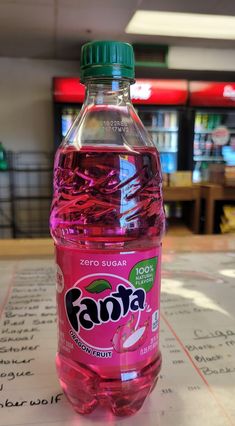 a bottle of fanta water sitting on top of a table