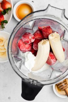 strawberries and bananas in a blender with other ingredients