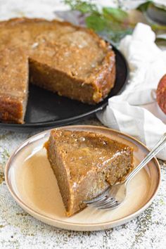 a piece of pie on a plate with a fork in it and another slice missing