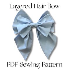 the layered hair bow pattern is shown in light blue and has a large bow on it