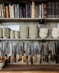 the shelves are full of many different types of knives