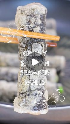 the chopsticks are on top of some seaweed rolls with text that reads crispy salmon, seaweed rolls