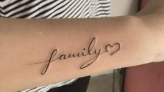 a woman's arm with the word family written in cursive writing on it