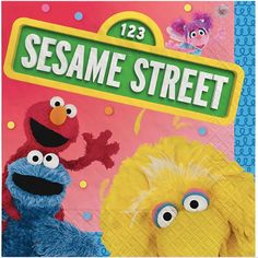 the sesame street sign is next to two cartoon characters