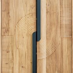 a close up of a wooden door with metal handles