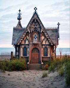 an old style house on the beach by the ocean