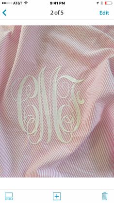 an image of a pink and white shirt with the letter m on it's chest