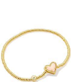 From Kendra Scott&#x2C; this bracelet features:Stretch bracelet14K gold over brass Stretch&#x2C; no closure Approx. 6.5" unstretched length Imported. Adjustable Pink Gold Bracelet For Valentine's Day, Gold Adjustable Heart Shaped Stretch Bracelet, Adjustable Gold Heart Stretch Bracelet, Adjustable Gold Heart-shaped Stretch Bracelet, Adjustable Gold Stretch Bracelet With Heart Charm, Gold Heart-shaped Adjustable Stretch Bracelet, Gold Stackable Heart Bracelets, Gold Heart-shaped Stackable Bracelets, Gold Charm Bracelet With Heart Beads For Friendship