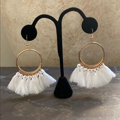 Details Are New Never Worn Brand: Candy Did It! Gold Plated 8 White Tassels On Each Earring Hook Earrings Very Light Weight They Hang At The Perfect Length Measure Approx 3.5” Long 1.5” Wide Across The Circle In New Condition No Defects One Of My Most Popular Earring Trendy White Tassel Drop Earrings, Bohemian White Tassel Earrings For Pierced Ears, Elegant White Fringe Earrings, White Tassel Earrings For Pierced Ears Party, White Tassel Dangle Earrings, Trendy White Tassel Earrings For Summer, White Dangle Tassel Earrings For Party, Elegant White Summer Tassel Earrings, White Dangle Jewelry With Tassels