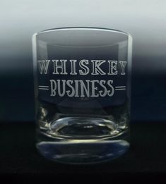 a shot glass with the words whiskey business printed on it