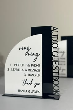 two black and white business cards with the words ring rings on them, one for each phone