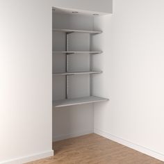 an empty white closet with shelves in it