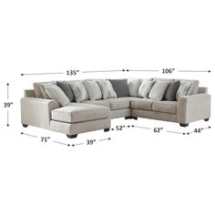 a sectional couch with pillows and measurements for it