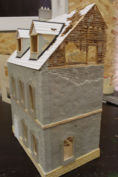 a model of a house made out of clay