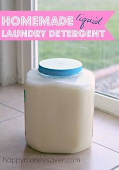 a white jug sitting on top of a tile floor next to a window with the words homemade liquid laundry deterent