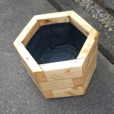 an empty wooden box sitting on the ground