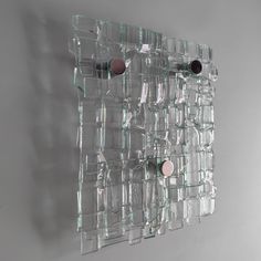 there is a glass wall hanging on the wall