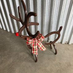 a wooden reindeer with a bow on it's back