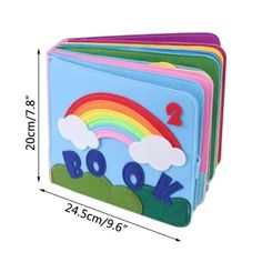 a set of four children's wallets with rainbow and clouds on the front