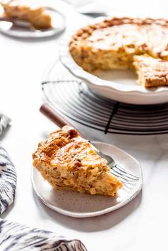 a slice of pie sitting on top of a white plate next to another piece of pie