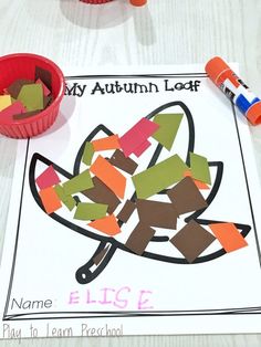 an autumn leaf craft with crayons on the paper