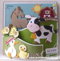 there is a card with animals and farm scenes on the front, along with flowers