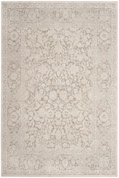 a beige and white rug with an intricate design