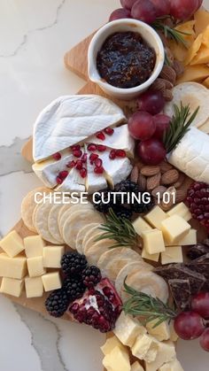 cheese cutting board with fruit and nuts on it