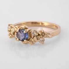 Custom Fairytale Blue Sapphire and diamond engagement ring, embellished with butterflies, flowers and leaves - a ring emulating a magical forest, just like the magic of your love. CUSTOMIZATION * This ring is customizable with a stone of your choice (extra fees may apply - please inquire) TECHNICAL DETAILS * 14K solid gold * Width of the blue sapphire is approximately 4mm * Diamonds are 4 x 0.017ct VS/SI white diamonds * Thickest part of the ring shank is approximately 2cm NOTES about our GOLD * Fairytale Butterfly, Flowers Engagement, Butterfly Engagement Ring, Fairytale Ring, Butterfly And Flowers, Gold Flower Ring, Butterflies Flowers, Ring Shank, Victorian Rings