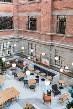 an overhead view of a restaurant with tables, chairs and couches in the center