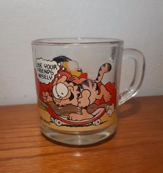 a glass mug with an image of a cartoon character on it