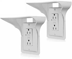 two white electrical outlet covers are shown