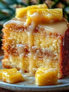 a piece of cake with icing and pineapple slices