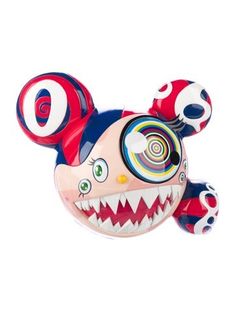 a red, white and blue toy with big teeth