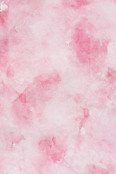 an abstract pink background with white spots