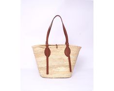 Do you want to look stylish and hippy? Get your hands on this handmade straw bag. It's high quality, eco-friendly, and handcrafted by women in Morocco. Its design is unique and timeless. Get yours now! we are proud to introduce our signature straw french bag to you. it is handmade by our talented artisan who has been working with us for years. this beautiful bag has a unique design that you would find nowhere else. the light and durable material are ideal for taking the bag on your adventures. S Spring Beach Bag In Natural Woven Leather, Spring Natural Woven Leather Beach Bag, Spring Season Natural Woven Leather Beach Bag, Spring Jute Straw Bag With Leather Handles, Spring Beach Bag With Woven Leather And Straw, Spring Beach Bag In Woven Leather And Straw, Spring Woven Leather Straw Beach Bag, Spring Straw Beach Bag With Woven Leather, Spring Jute Beach Bag With Leather Handles