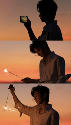 a man holding a sparkler in one hand and a cell phone in the other