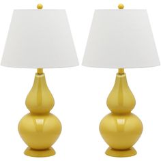 two yellow lamps sitting next to each other