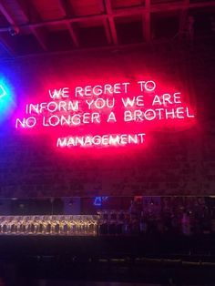 a neon sign that reads we report to inform you are no longer a brother management