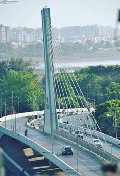 an aerial view of a bridge with cars driving on it