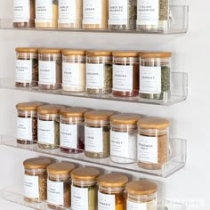 the shelves are filled with spices and seasonings